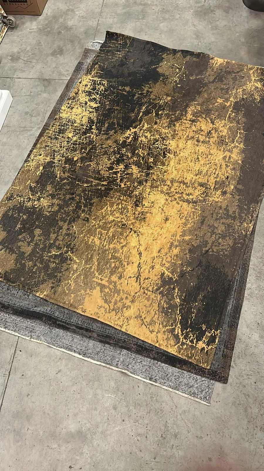 Zwart-goud vloerkleed